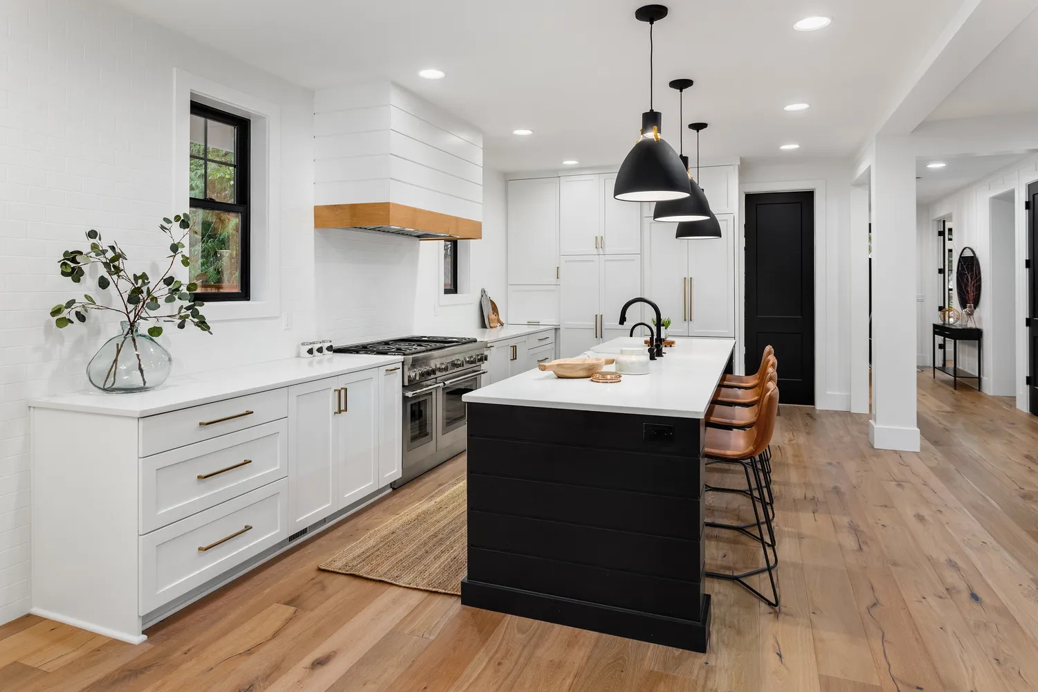 Elegant kitchen space featuring white cabinets paired with black countertops, suitable for home improvement ideas.